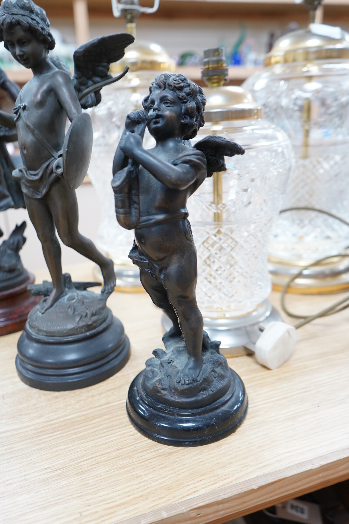 After Moreau - three statuettes, two bronze cherubs and a patinated spelter maiden, ‘Les Cerises’